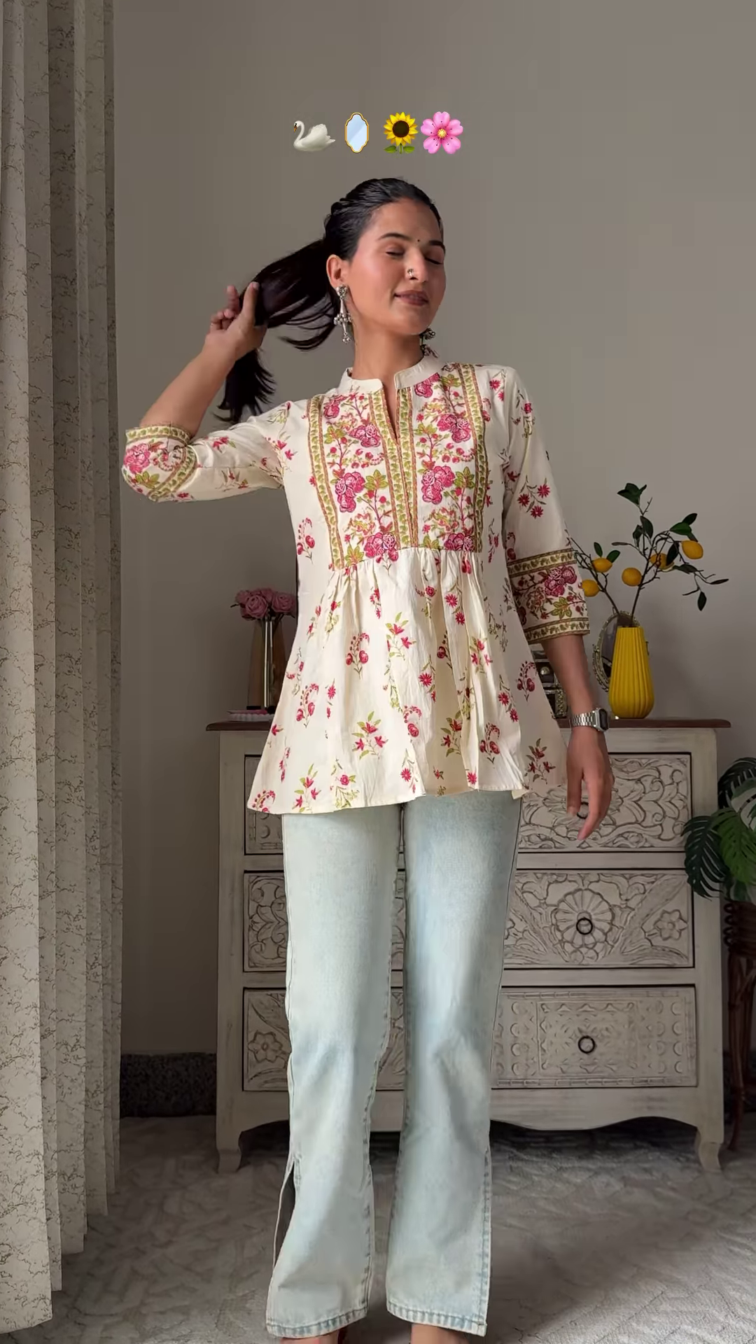 Women’s Sleeveless Red Floral Top with Light Blue Flared Jeans – Indo-Western Casualwear Styled with Vintage Decor Backdrop - Image 4