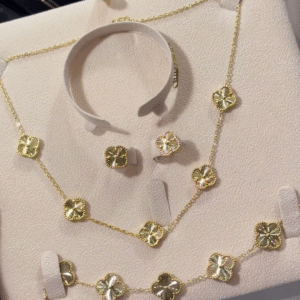 Elegant Gold-Toned Four-Leaf Clover Jewelry Set - Necklace, Bracelet, and Earrings