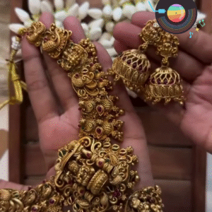 Traditional Gold-Toned Nagas Necklace Set with Intricate Deity and Elephant Carvings