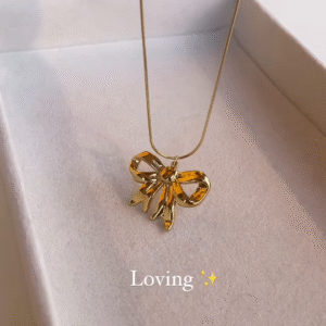 Elegant Gold-Toned Bow Pendant Necklace - Delicate and Charming