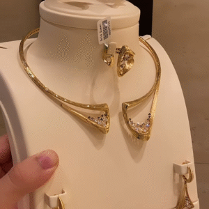 Modern Gold-Toned Jewelry Set with Geometric Cutouts and Crystal Accents - Necklace, Bracelet, Ring, Earrings