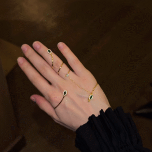 Elegant Gold-Toned Hand Chain Bracelet with Emerald-Colored Accents and Adjustable Rings