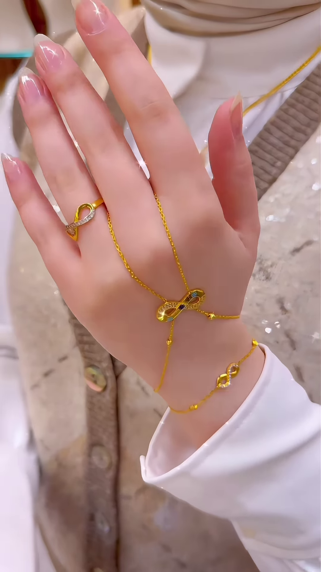 Elegant Gold-Toned Hand Chain Bracelet with Infinity Symbol and Sparkling Accents - Connected Ring